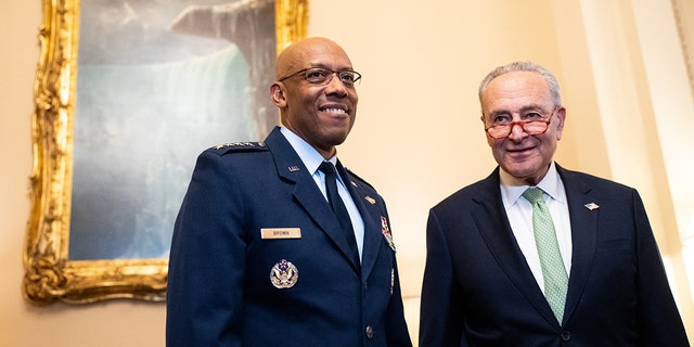 Gen. Charles Q. Brown stands next to Sen. Chuck Schumer, D-N.Y.