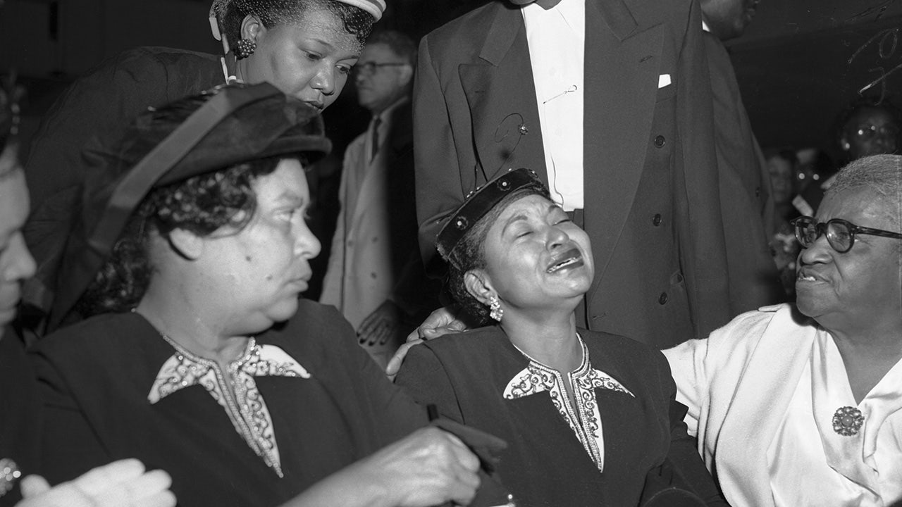 Emmett Till's mother cries at his funeral