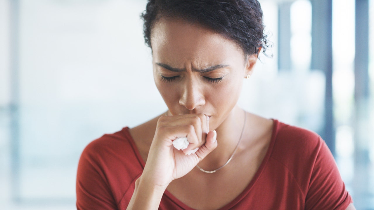 Woman coughing