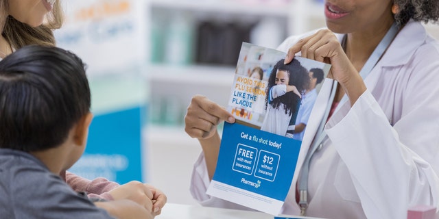 woman showing flu shot options