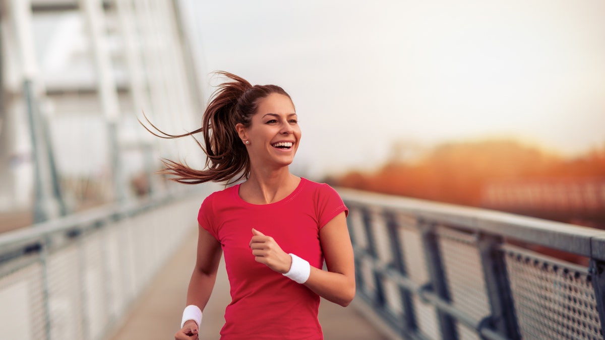 Young fitness woman jogging