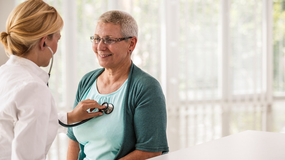 Cardiologist with patient