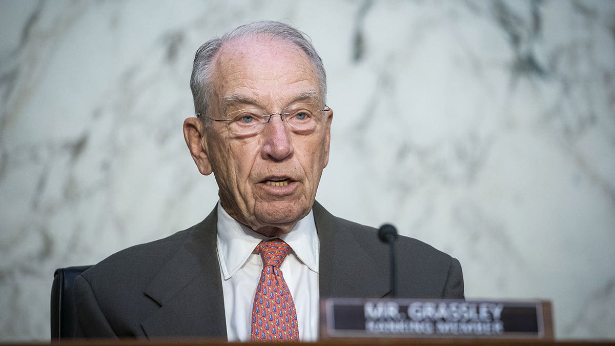 Sen. Chuck Grassley speaks into mircrophone during hearing