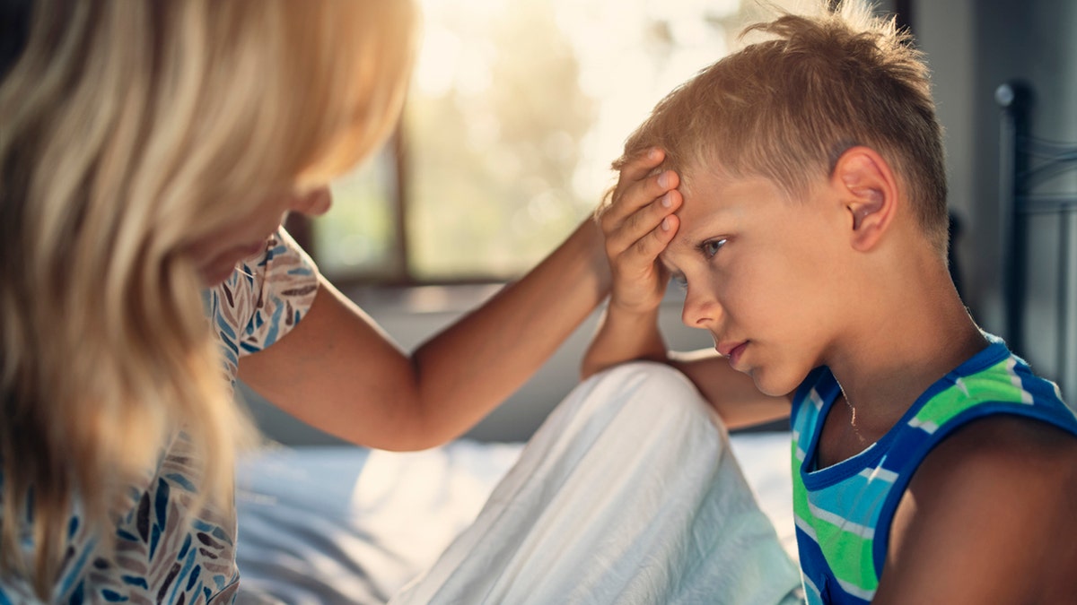 mom monitoring sick child