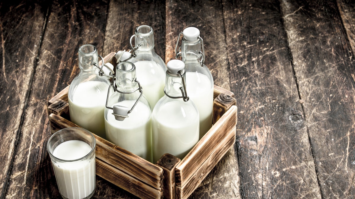 a collection of milk in bottles