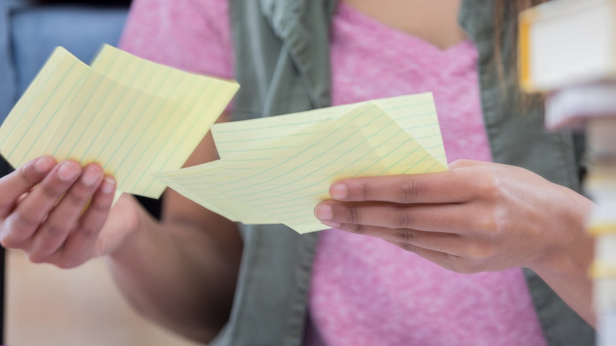 Teen reading notes