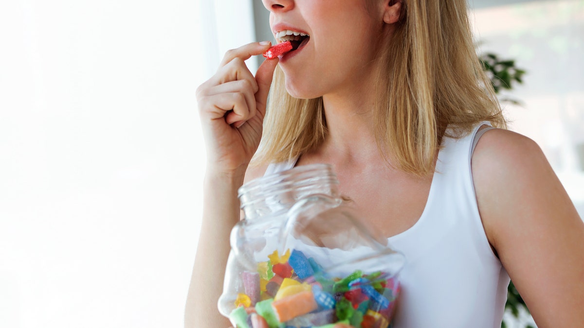 Woman eating candy