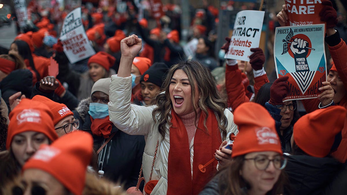 nurse on strike pumps fist