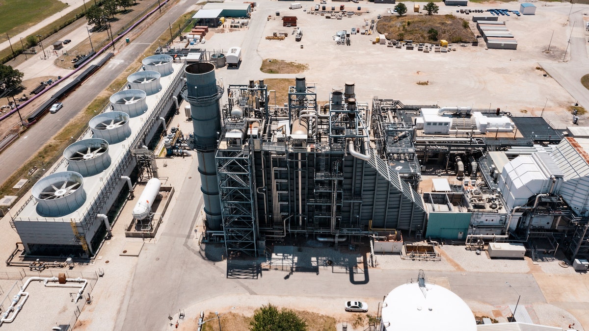 A power generating station during a heatwave outside of Austin, Texas, US, on Monday, July 11, 2022. Texas residents and businesses, including the biggest names in oil, autos and technology, are being asked to conserve electricity Monday afternoon during a heat wave that's expected to push the state's grid near its breaking point. Photographer: Jordan Vonderhaar/Bloomberg