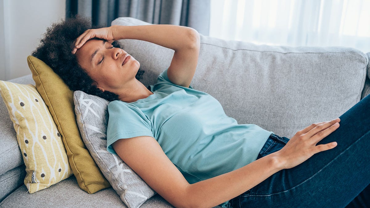 girl lying on sofa