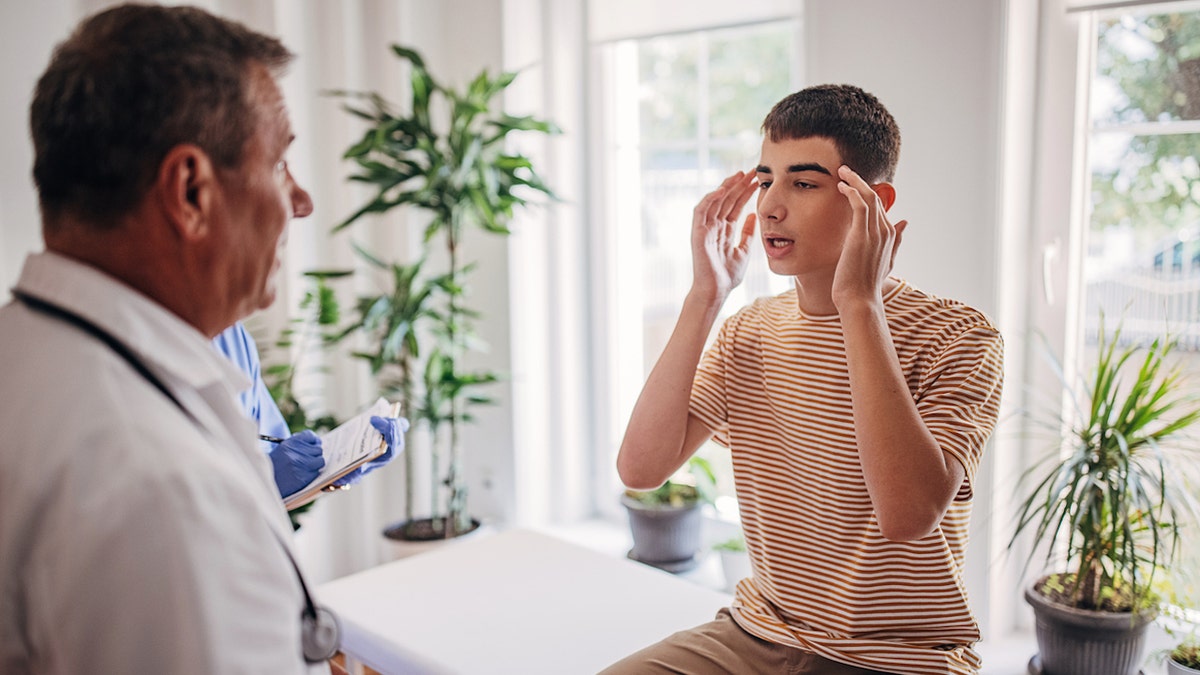 Teen boy at doctor