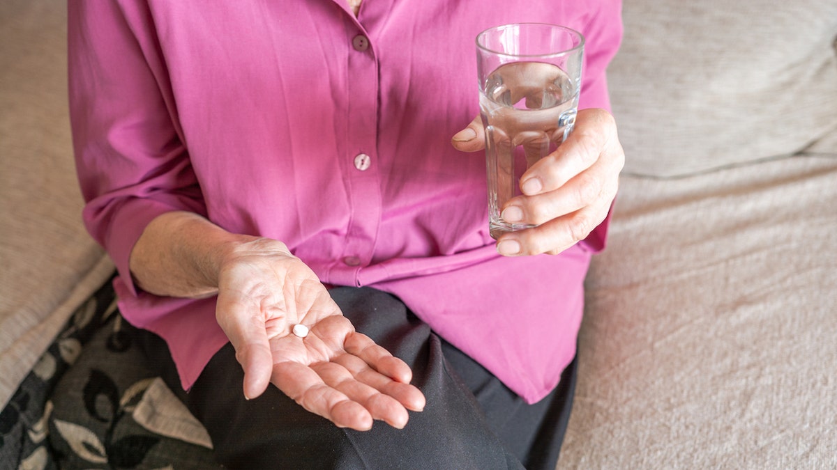 Woman taking pill