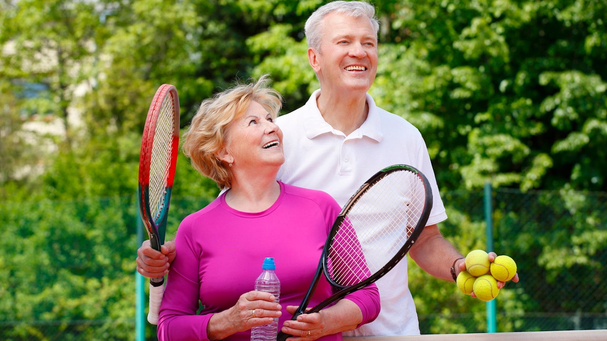 Couple playing pickleball