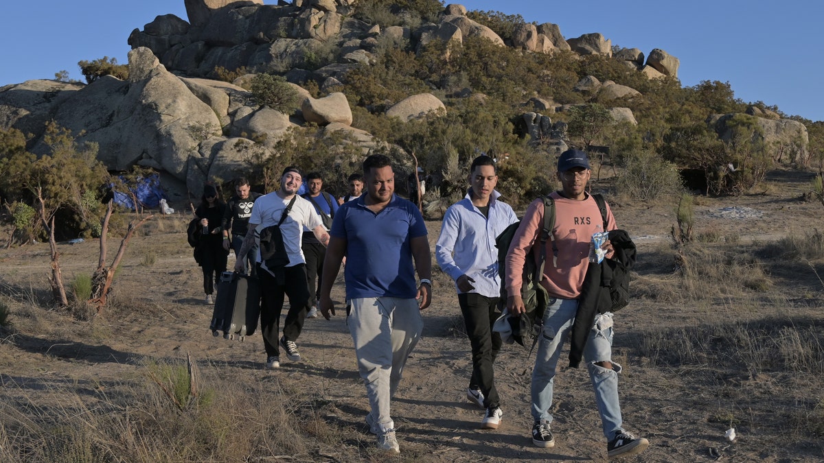 Migrants crossing the California-Mexico border into the U.S.