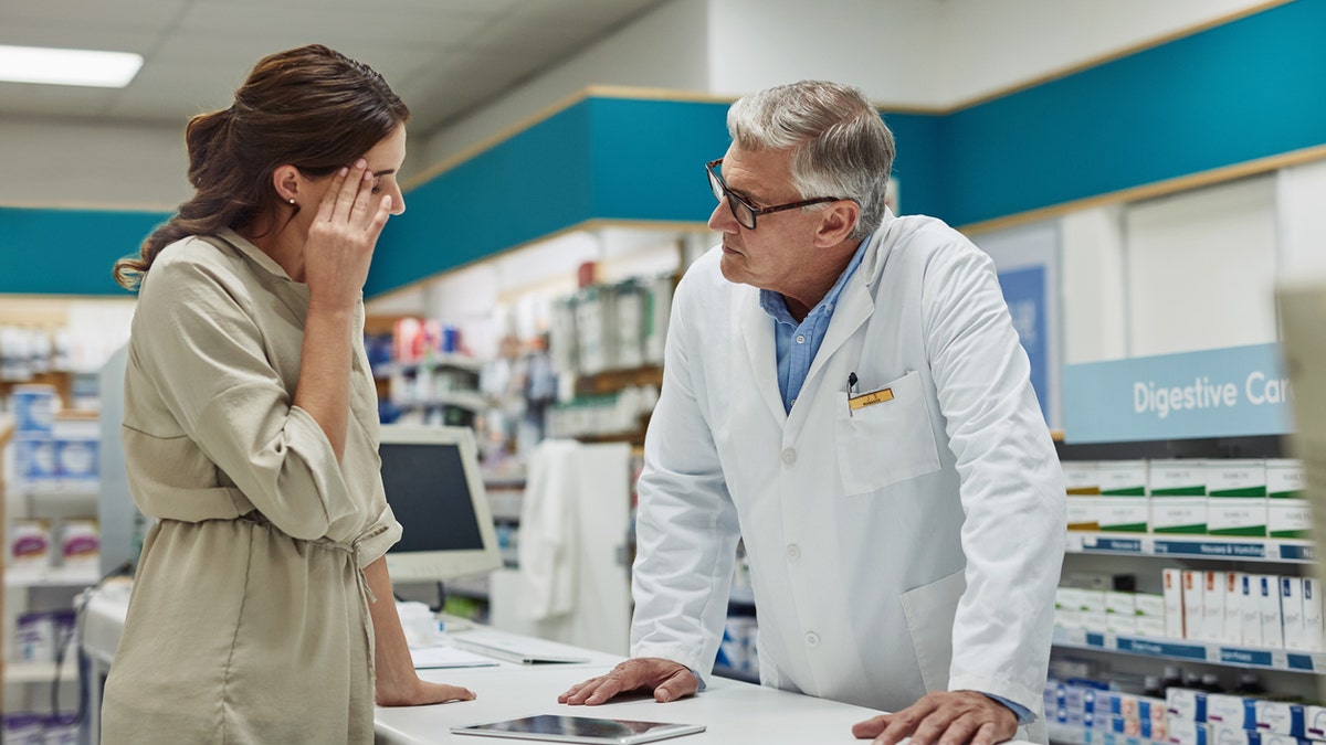 Woman sick at pharmacy