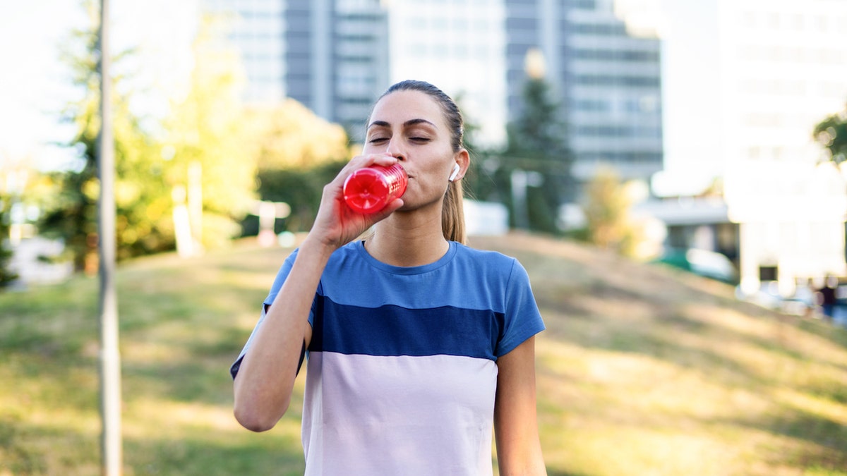 Girl drinking energy drinks