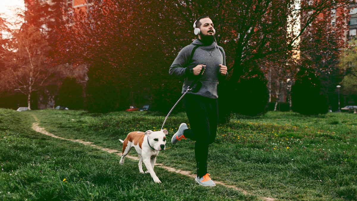 Man running with dog