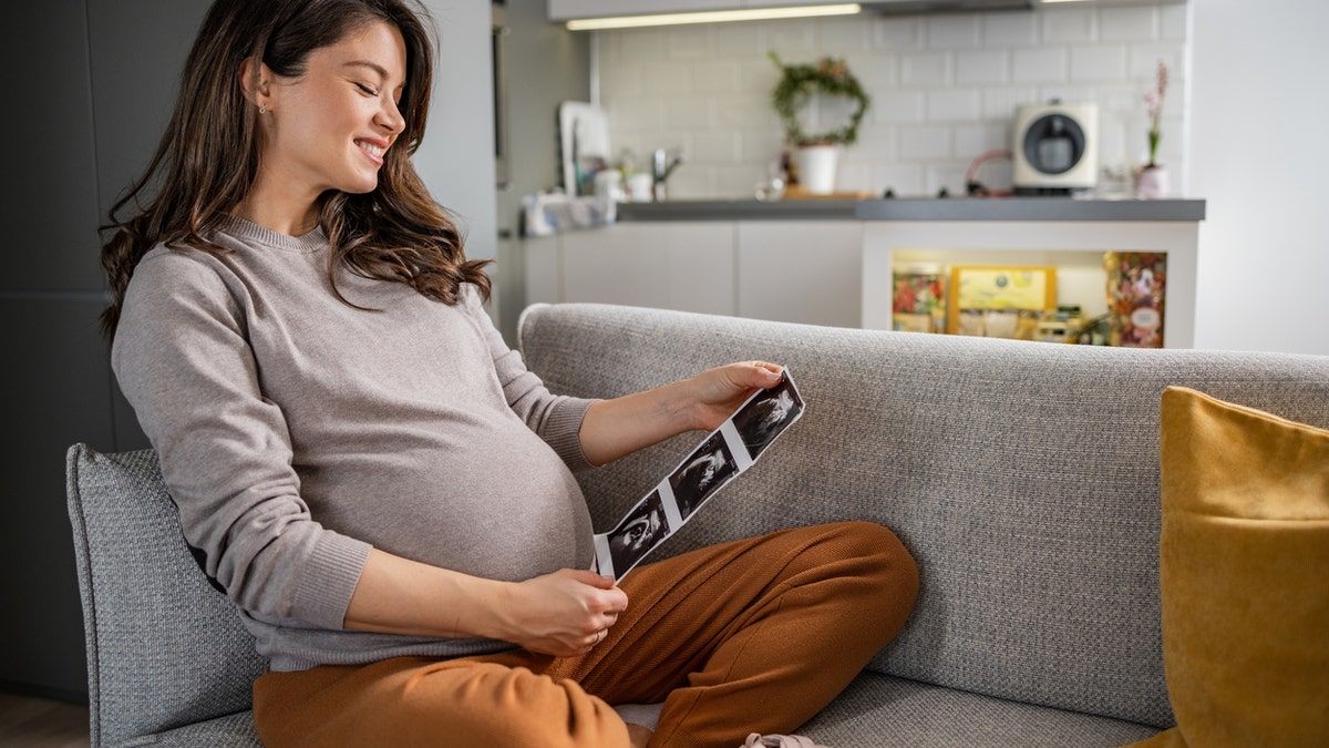 Pregnant woman with ultrasound