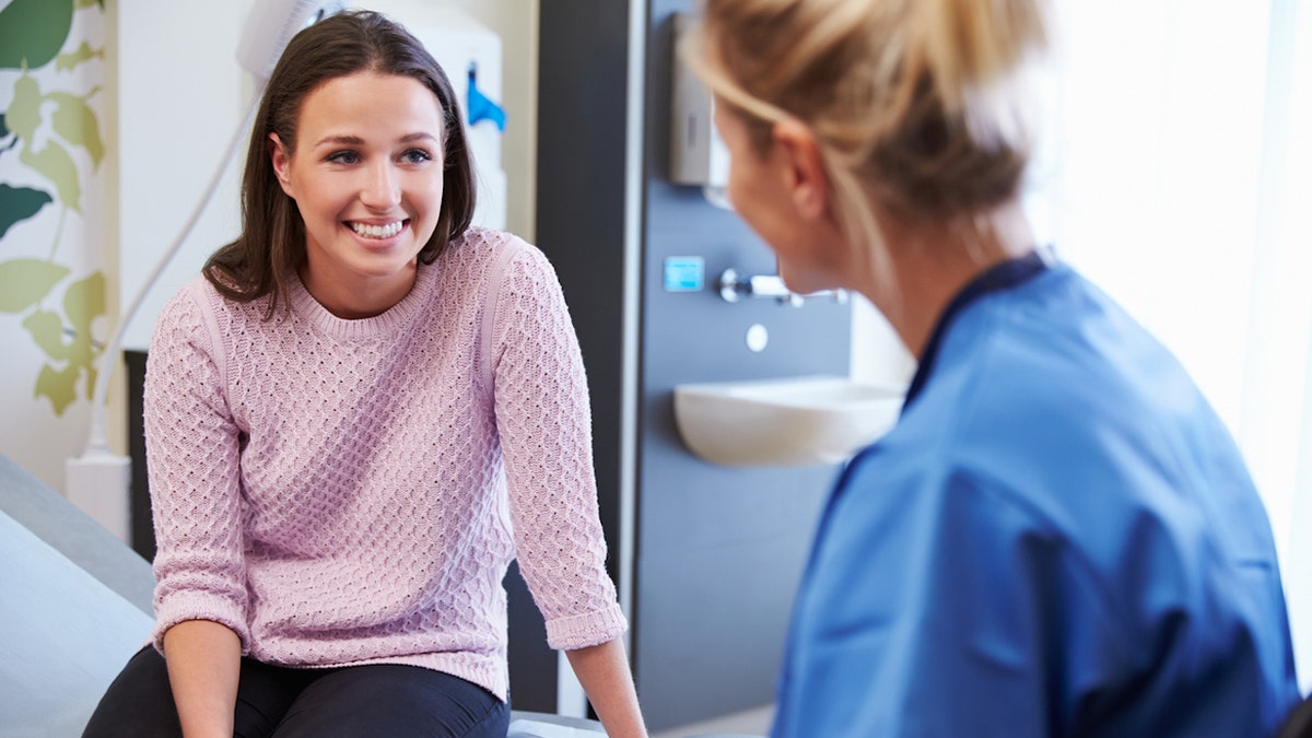 Woman with doctor