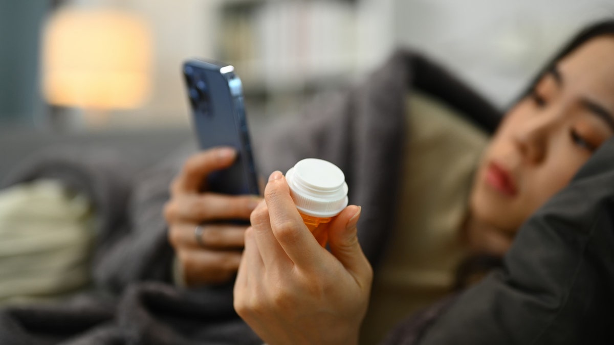 Woman holding prescription