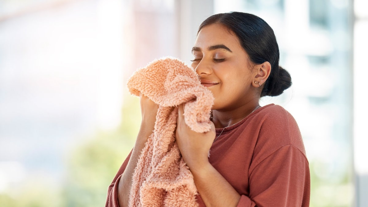 Woman smelling laundry