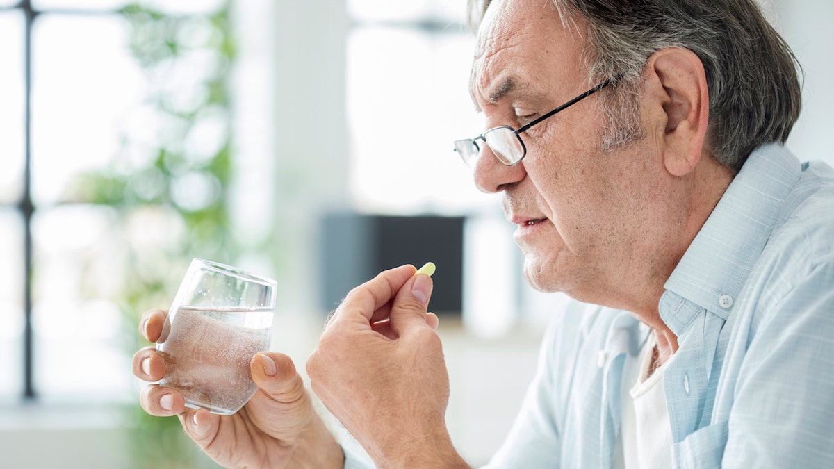 Man taking medicine